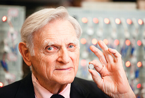 Photo of John B. Goodenough with his invention, the lithium-ion battery