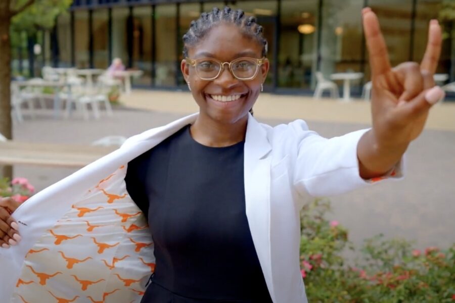 Thumbnail of a student making the Hook 'em Horns hand sign.